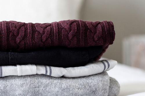 clothes folded up on bed