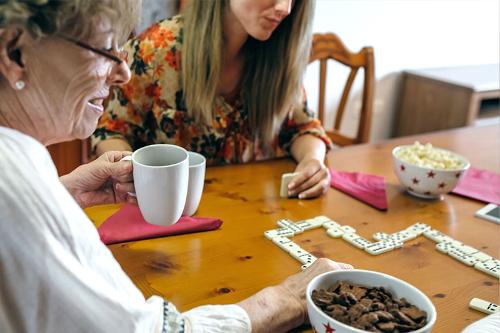 gathering playing dominoes